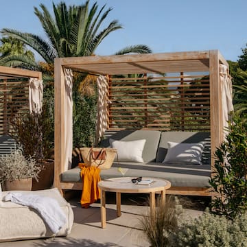 a patio with a couch and a table