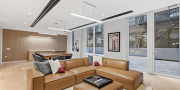 a living room with a large couch and a table