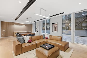 a living room with a large couch and a table