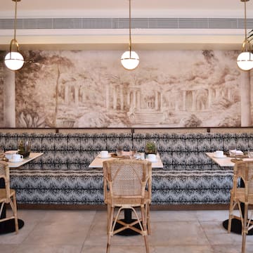a restaurant with tables and chairs