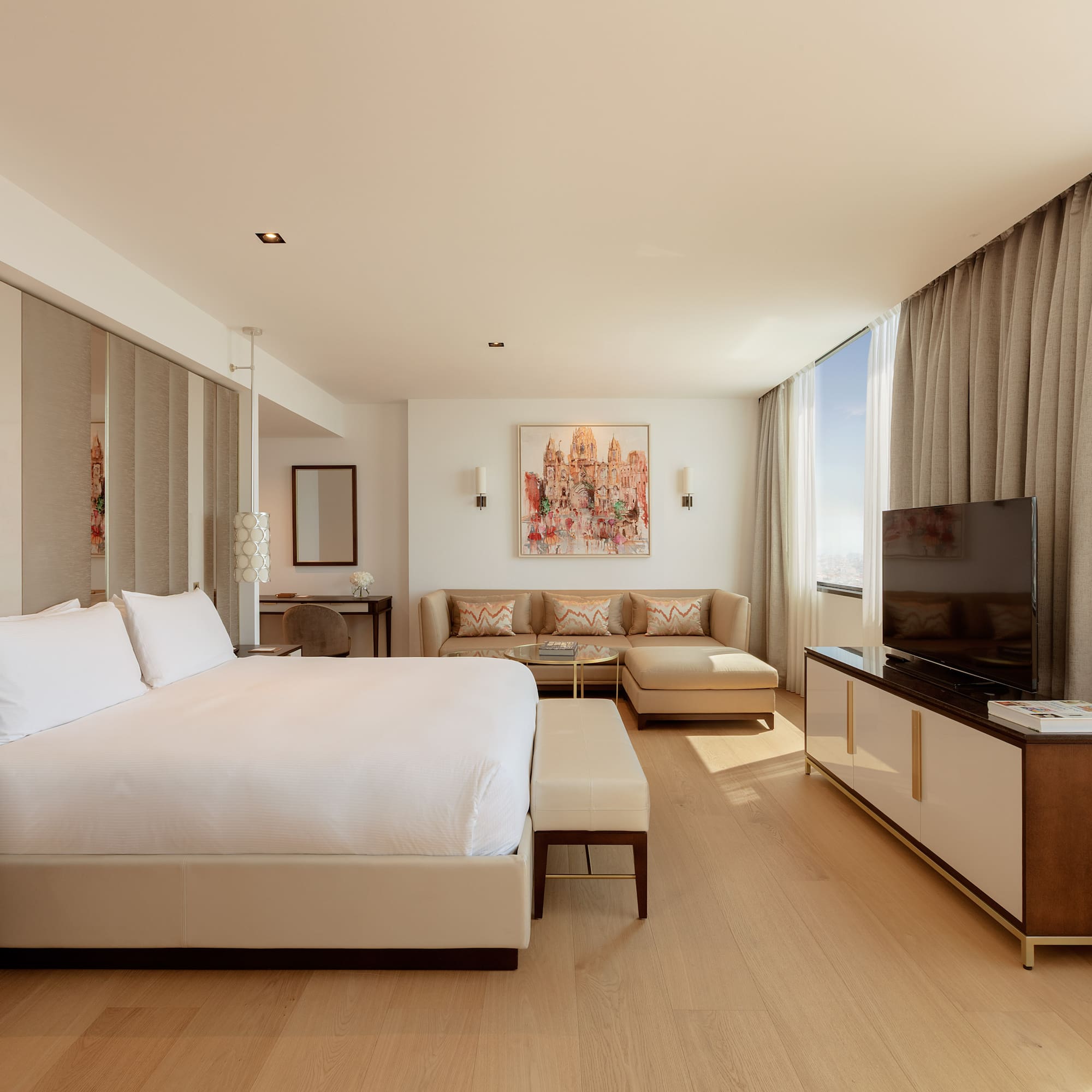 a room with a bed and couches