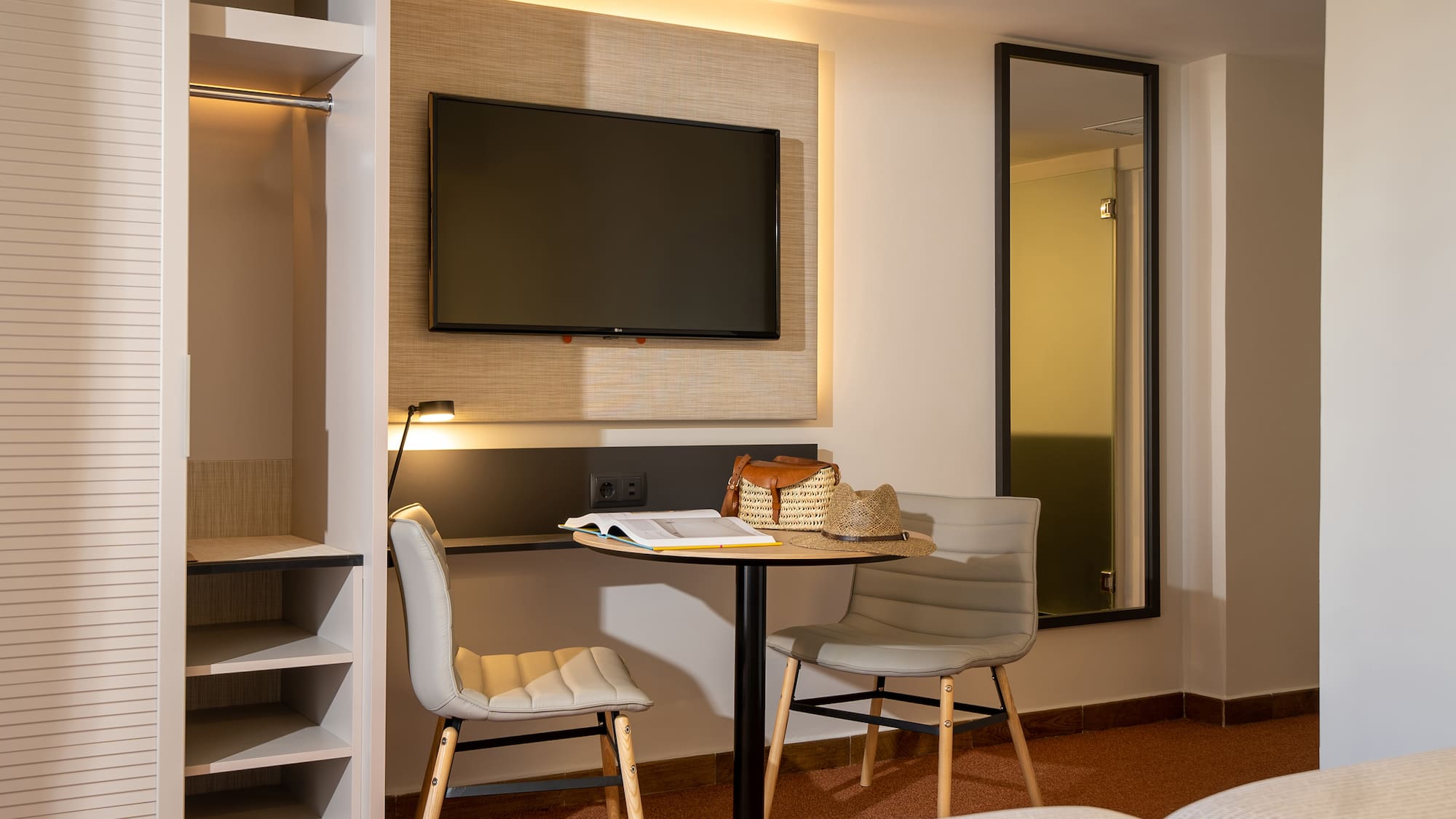 a room with a tv and a table