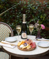 a table with food and wine on it