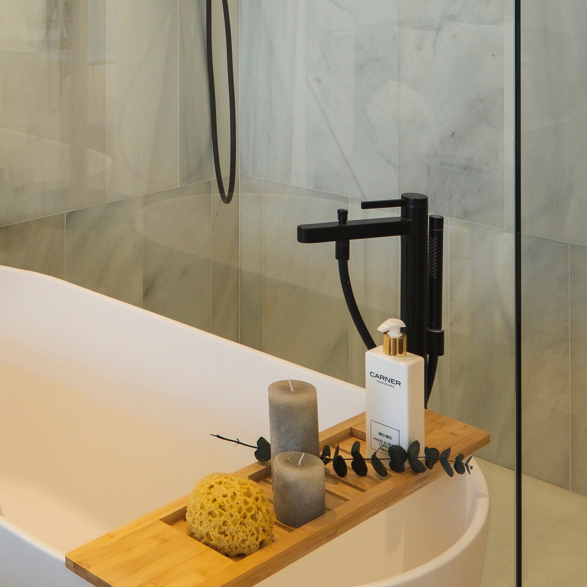 a shower with a bathtub and a shower head