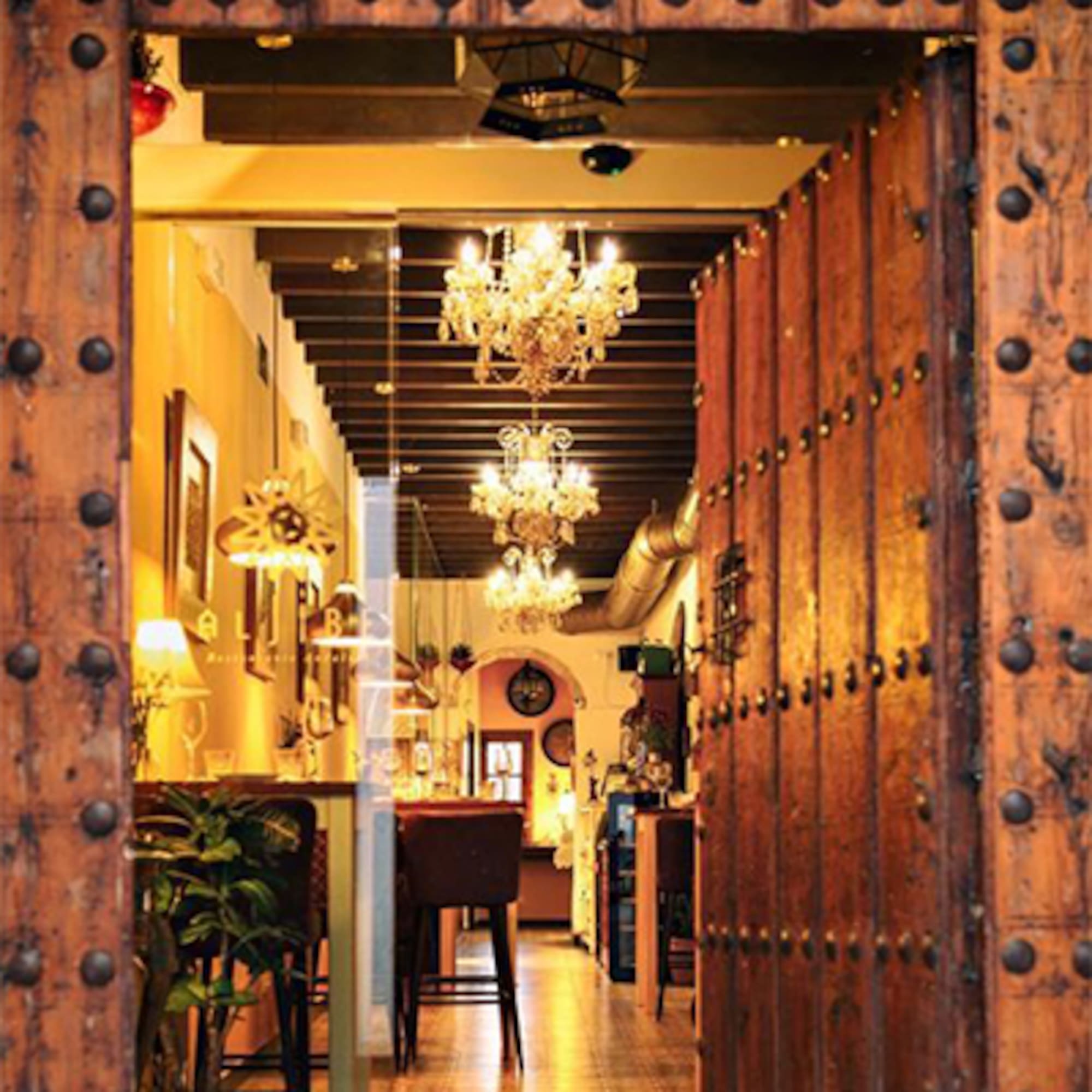 a doorway with a chandelier from it