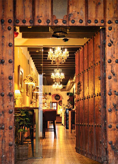 a doorway with a chandelier from it