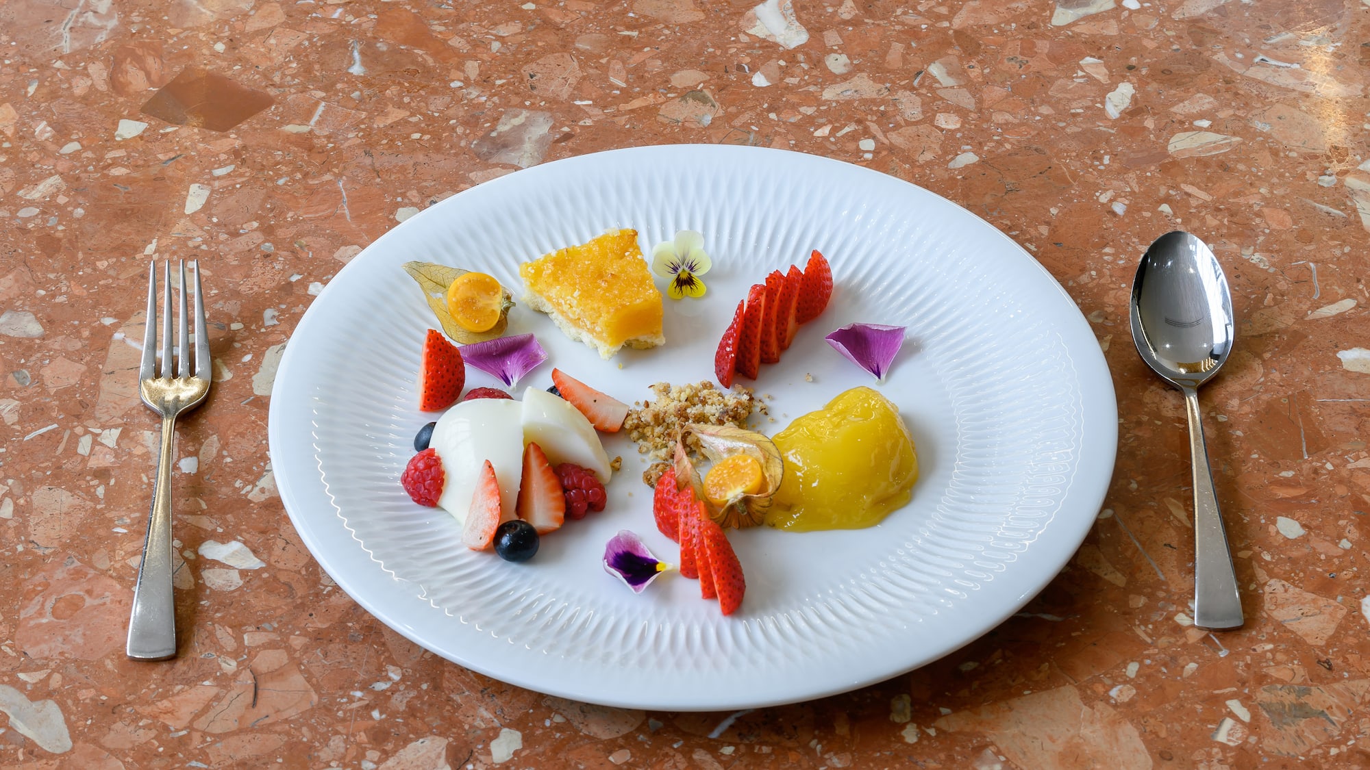 a plate of food on a marble surface