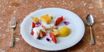 a plate of food on a marble surface