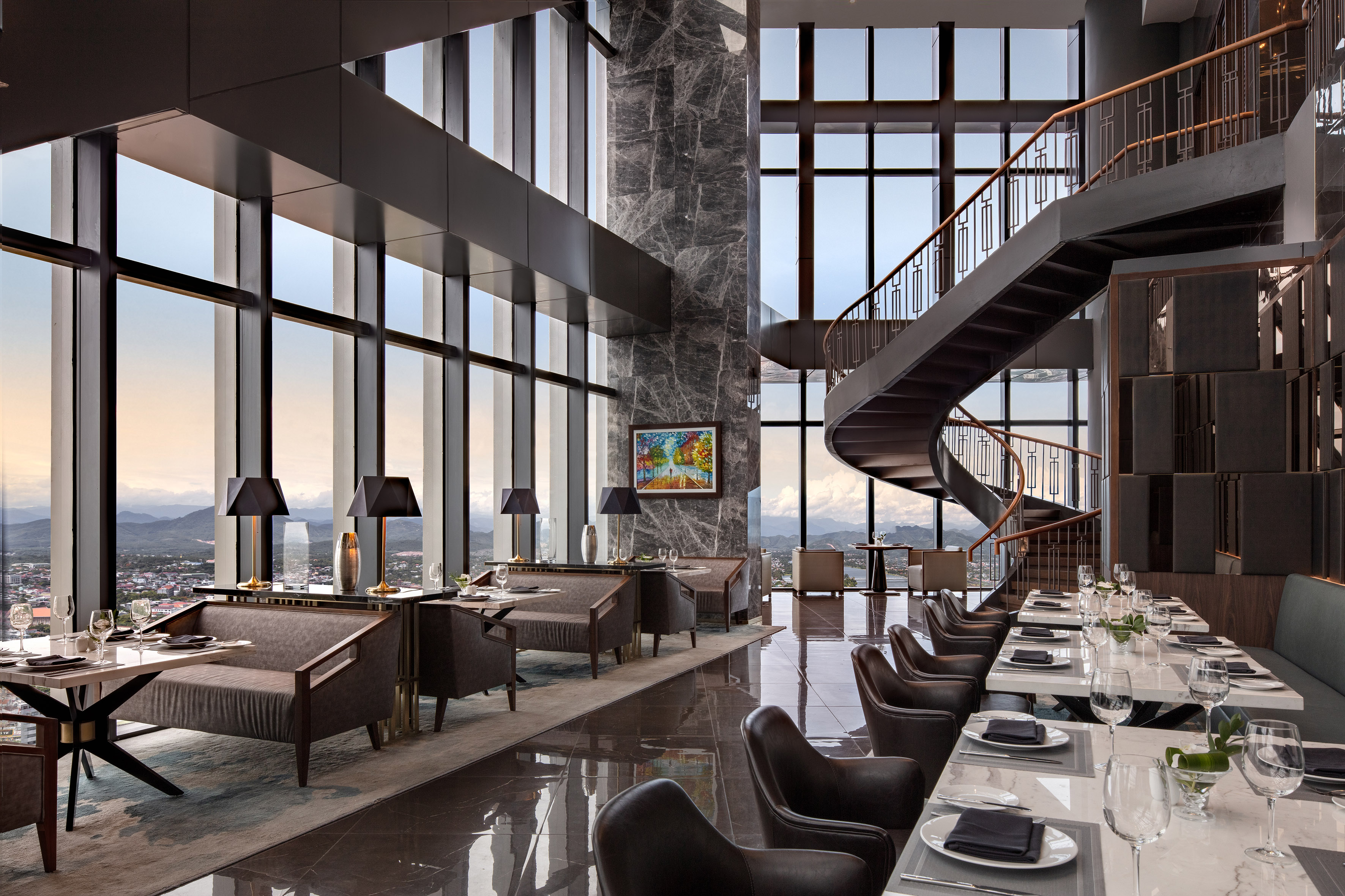 Elegant high-rise restaurant, panoramic city view, spiral staircase, modern dining.