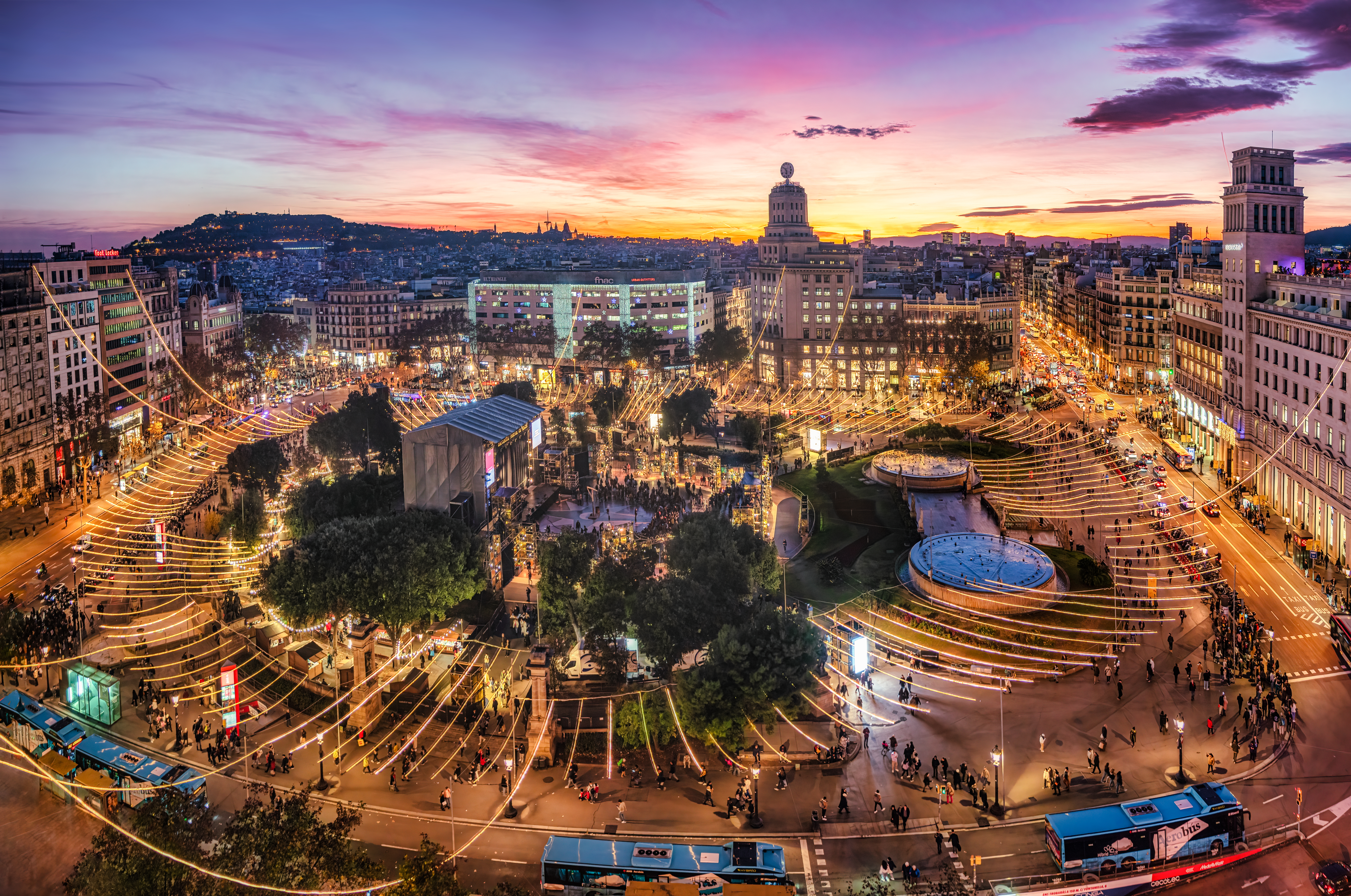 a city with lights and people