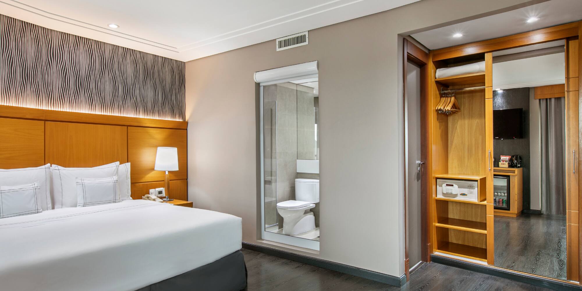 a bedroom with a bed and a closet