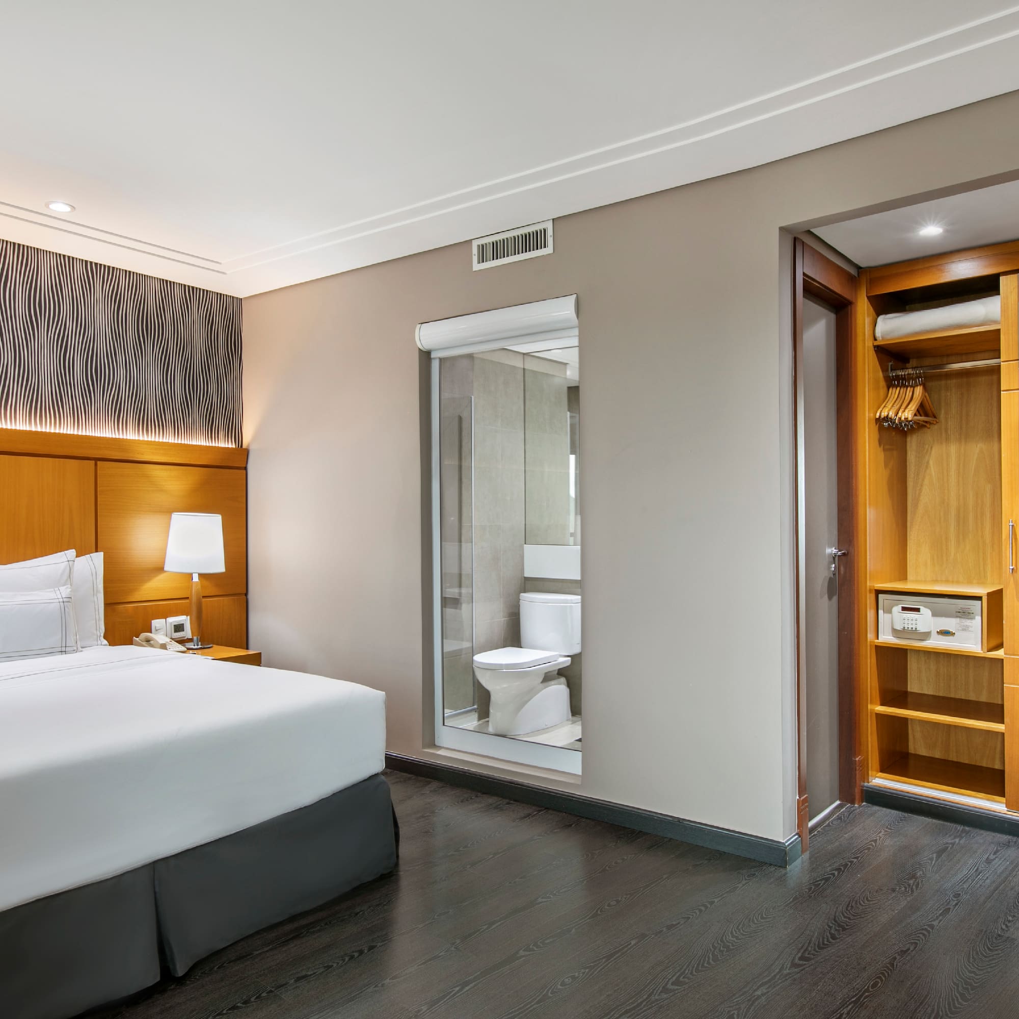 a bedroom with a bed and a closet