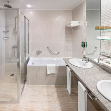 a bathroom with a shower and sink