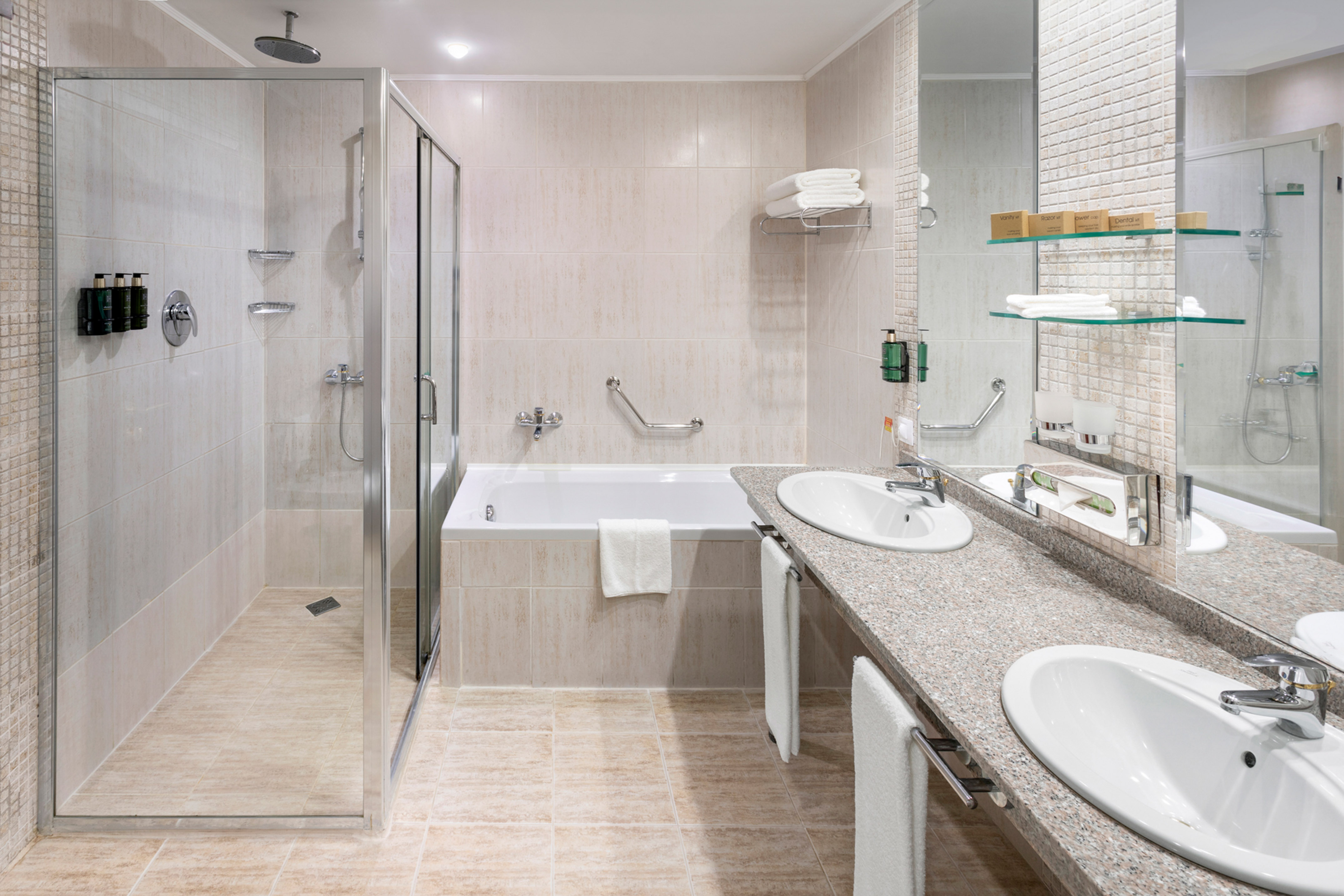 a bathroom with a shower and sink