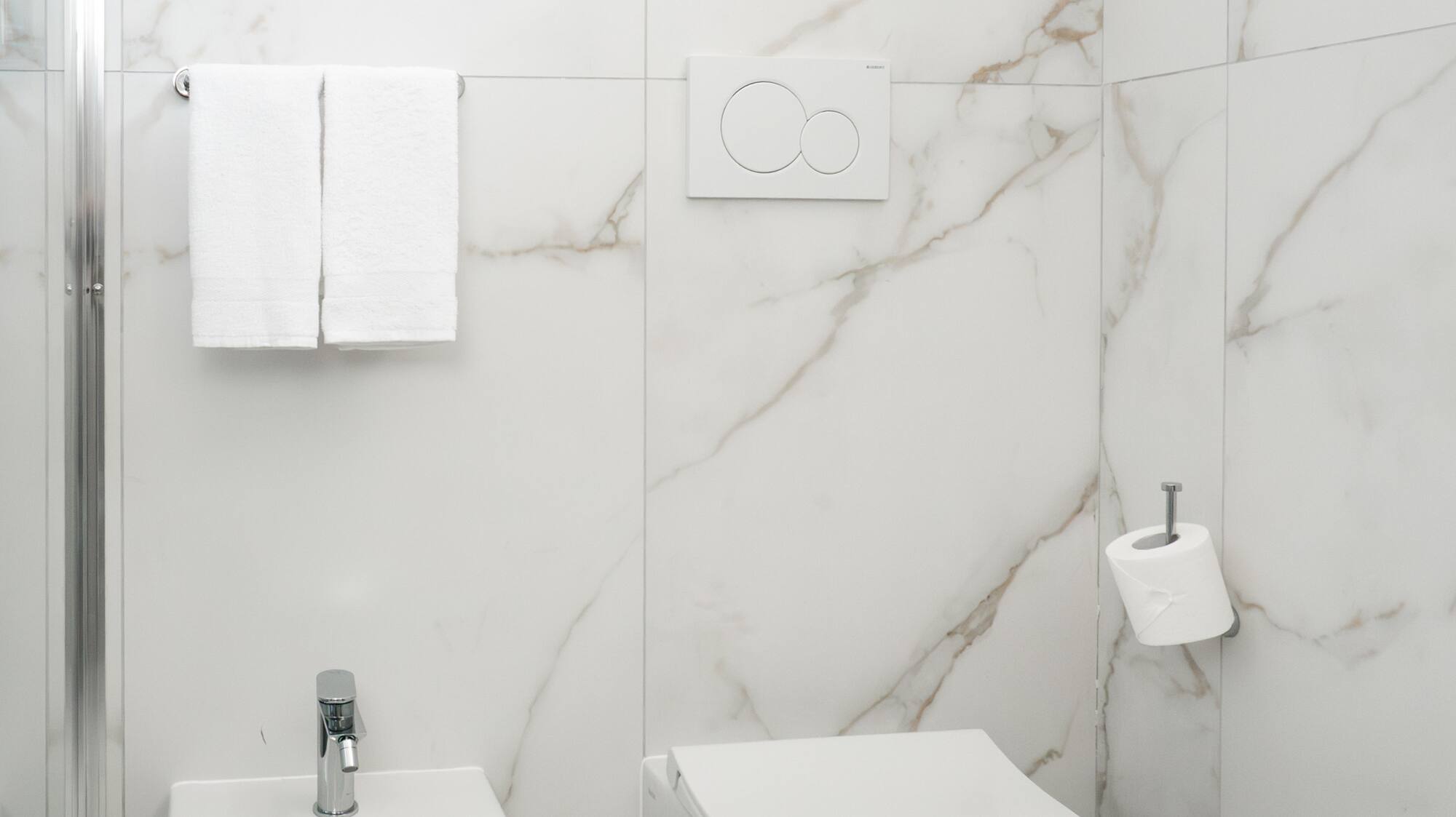 a toilet and bidet in a bathroom