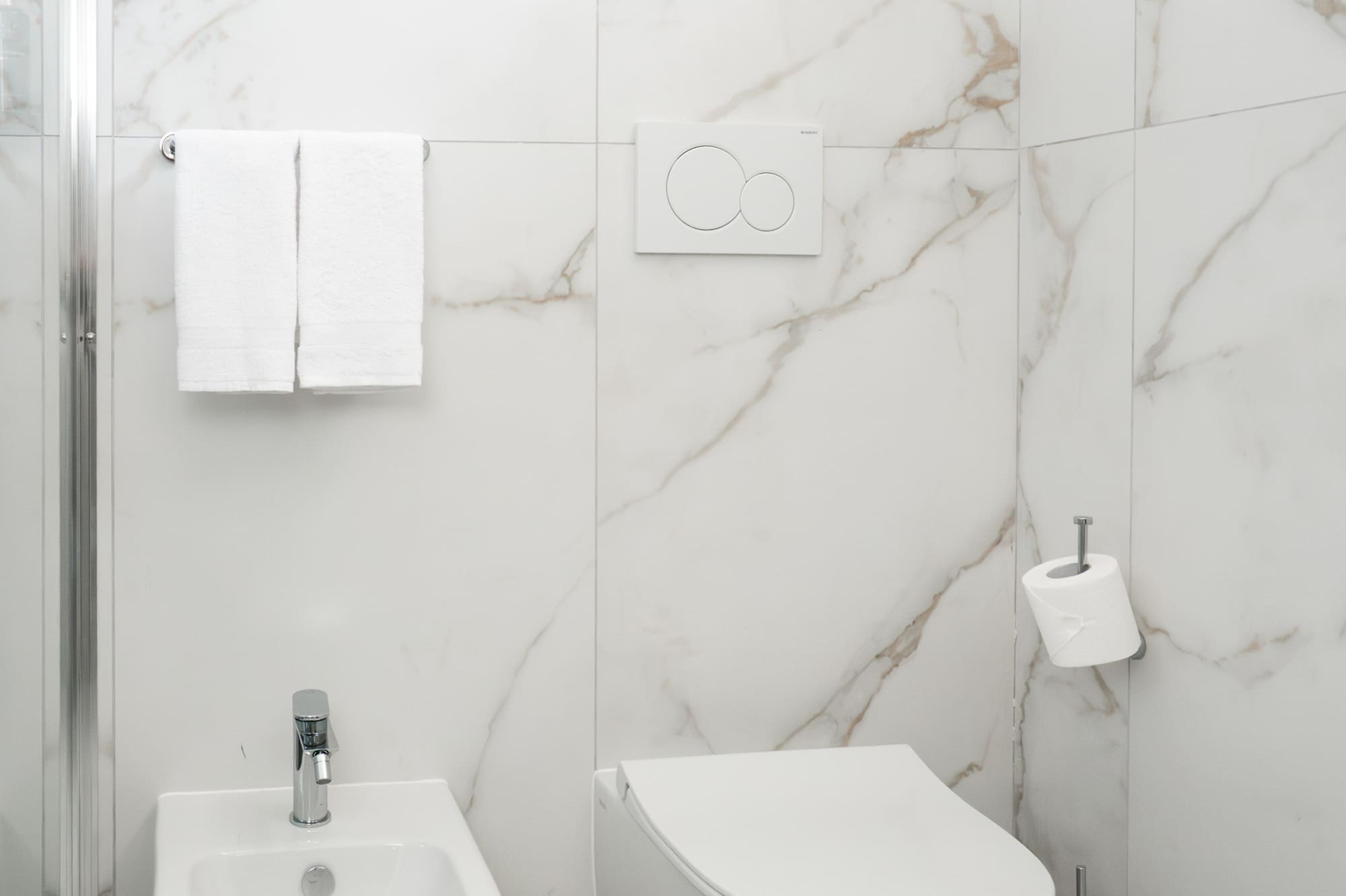 a toilet and bidet in a bathroom