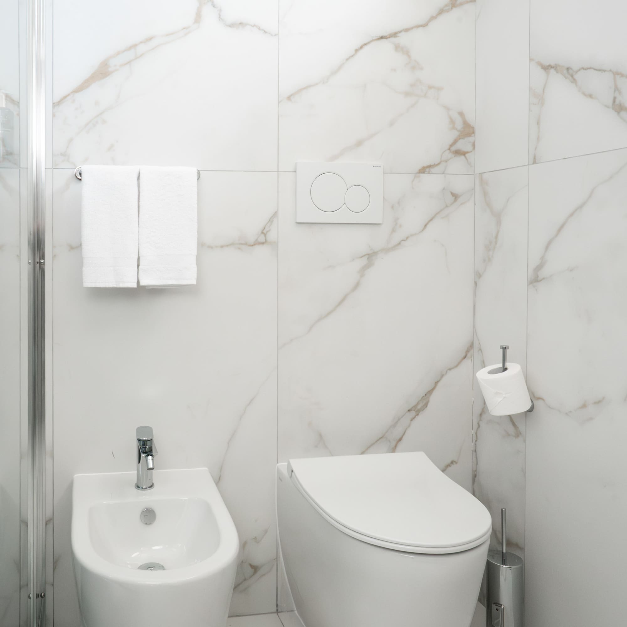 a toilet and bidet in a bathroom