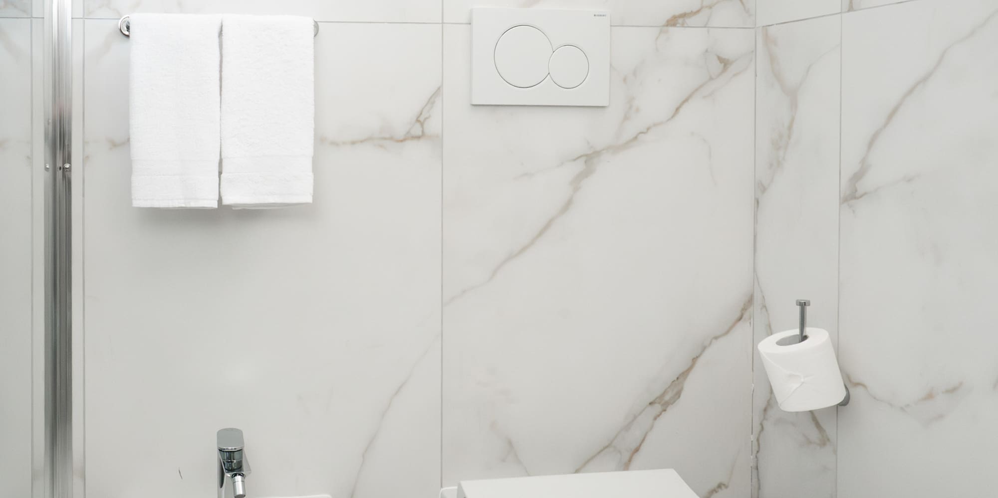 a toilet and bidet in a bathroom