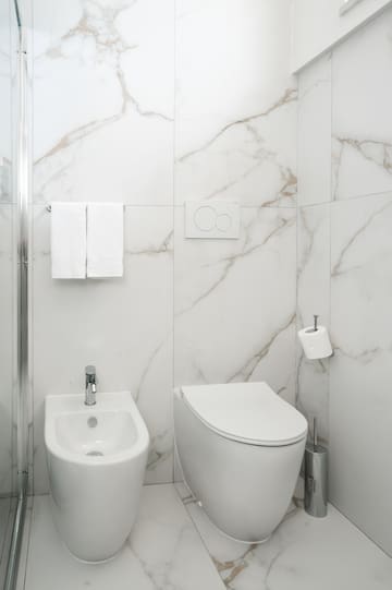 a toilet and bidet in a bathroom