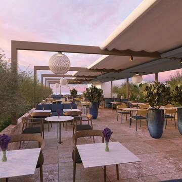 a patio with tables and chairs