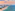 Fort Lauderdale oceanfront skyline, sandy beach, turquoise sea, and sunset sky.