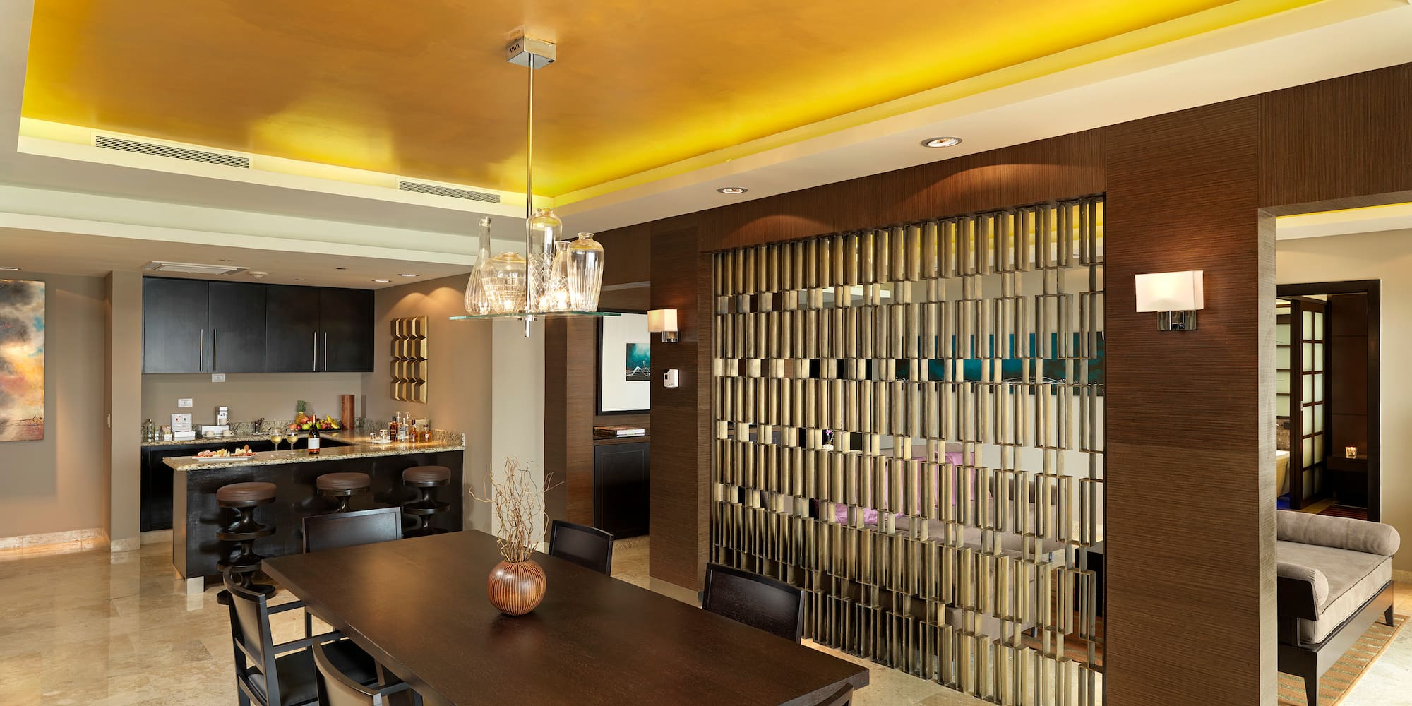 a dining room with a table and chairs