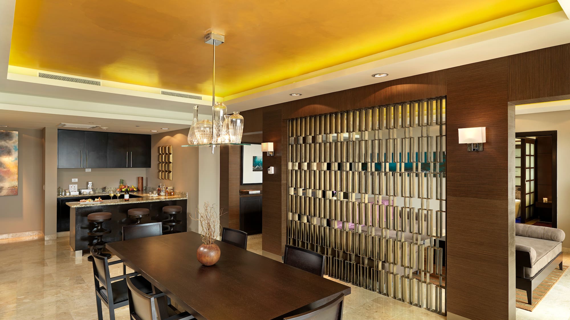 a dining room with a table and chairs