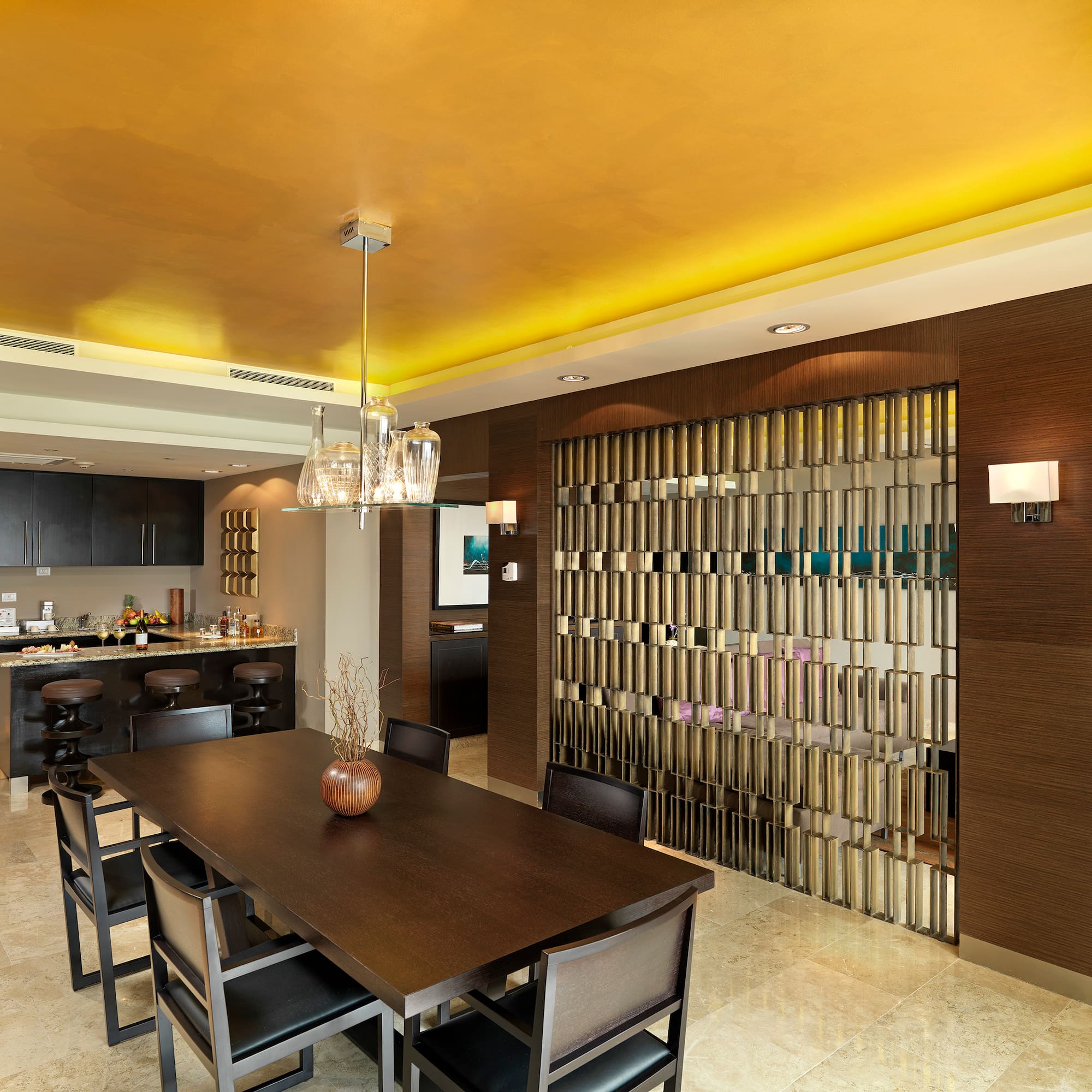 a dining room with a table and chairs