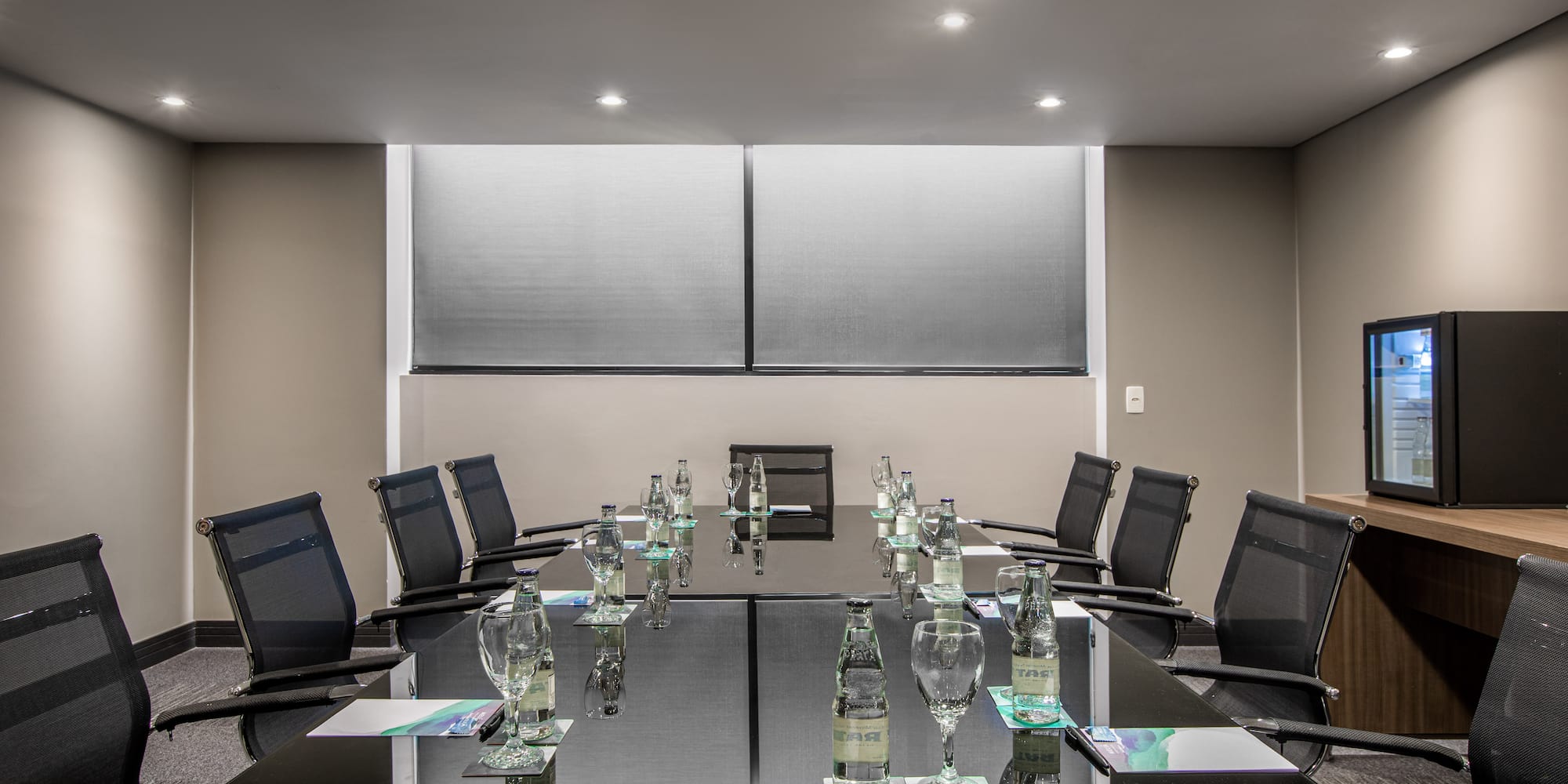 a conference room with a table and chairs