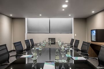a conference room with a table and chairs