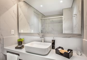 a bathroom with a sink and mirror