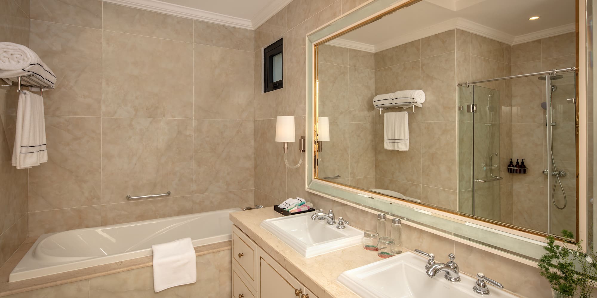 a bathroom with a large mirror and sink