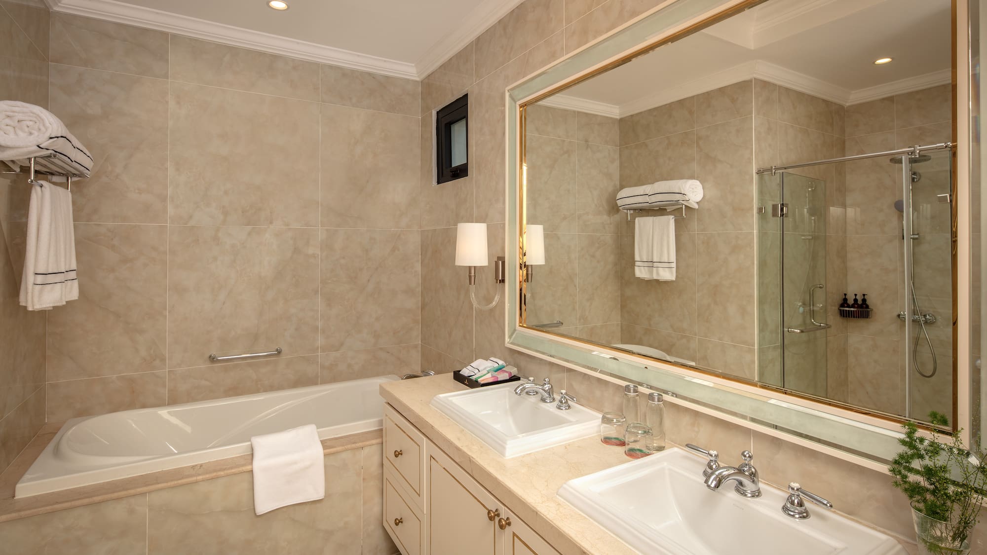 a bathroom with a large mirror and sink