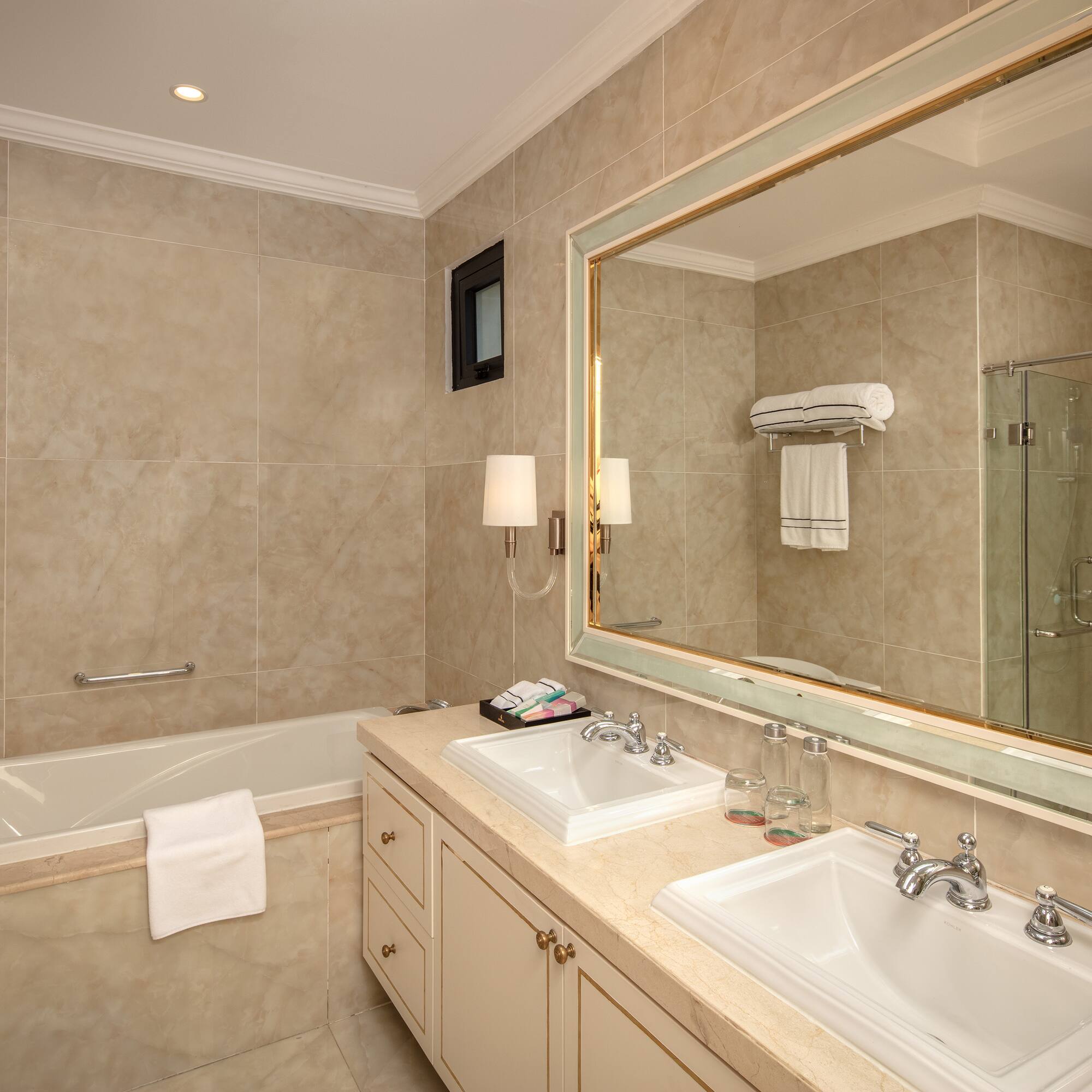 a bathroom with a large mirror and sink