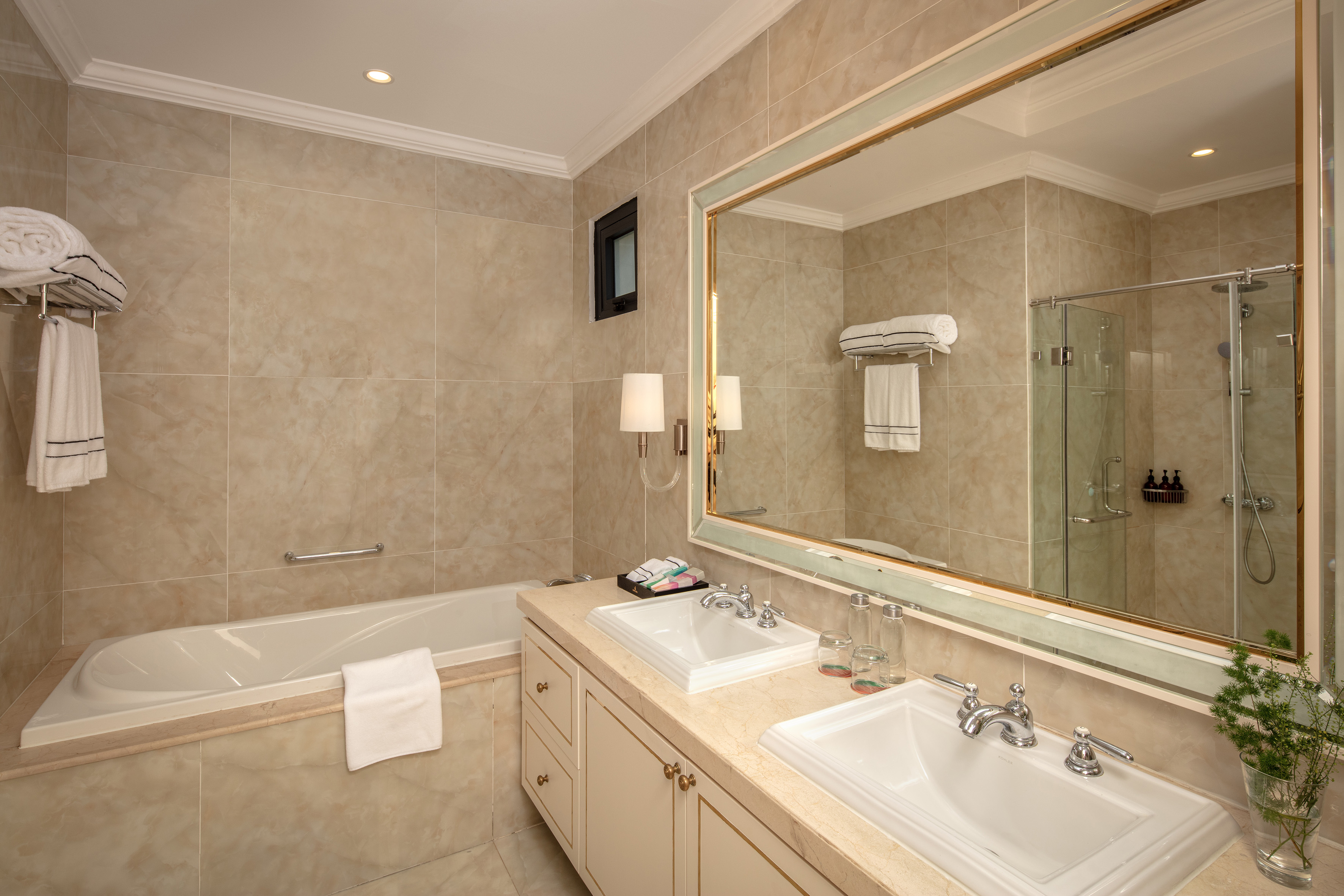 a bathroom with a large mirror and sink