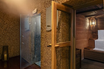 a room with a glass door and a sauna