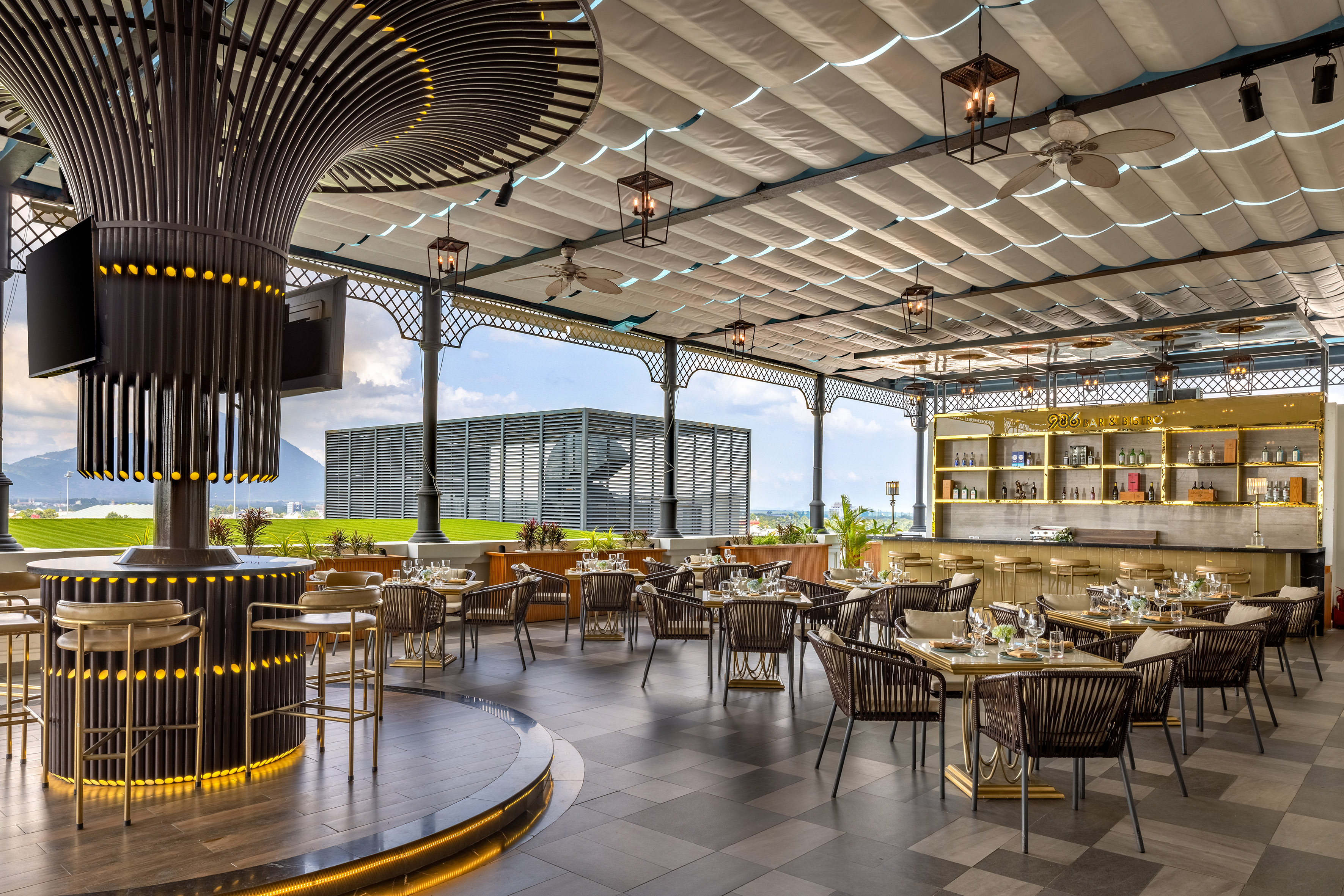 Modern rooftop restaurant and bar with outdoor seating and city views.