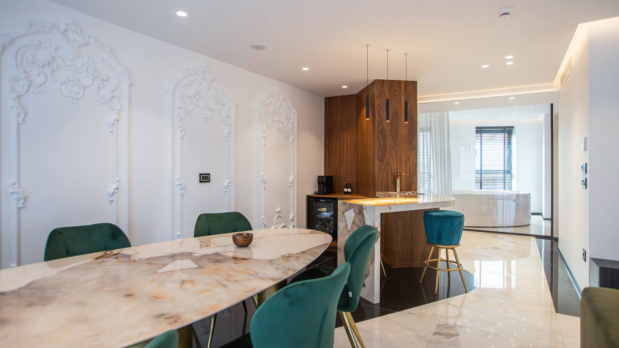a dining room with a marble table and chairs
