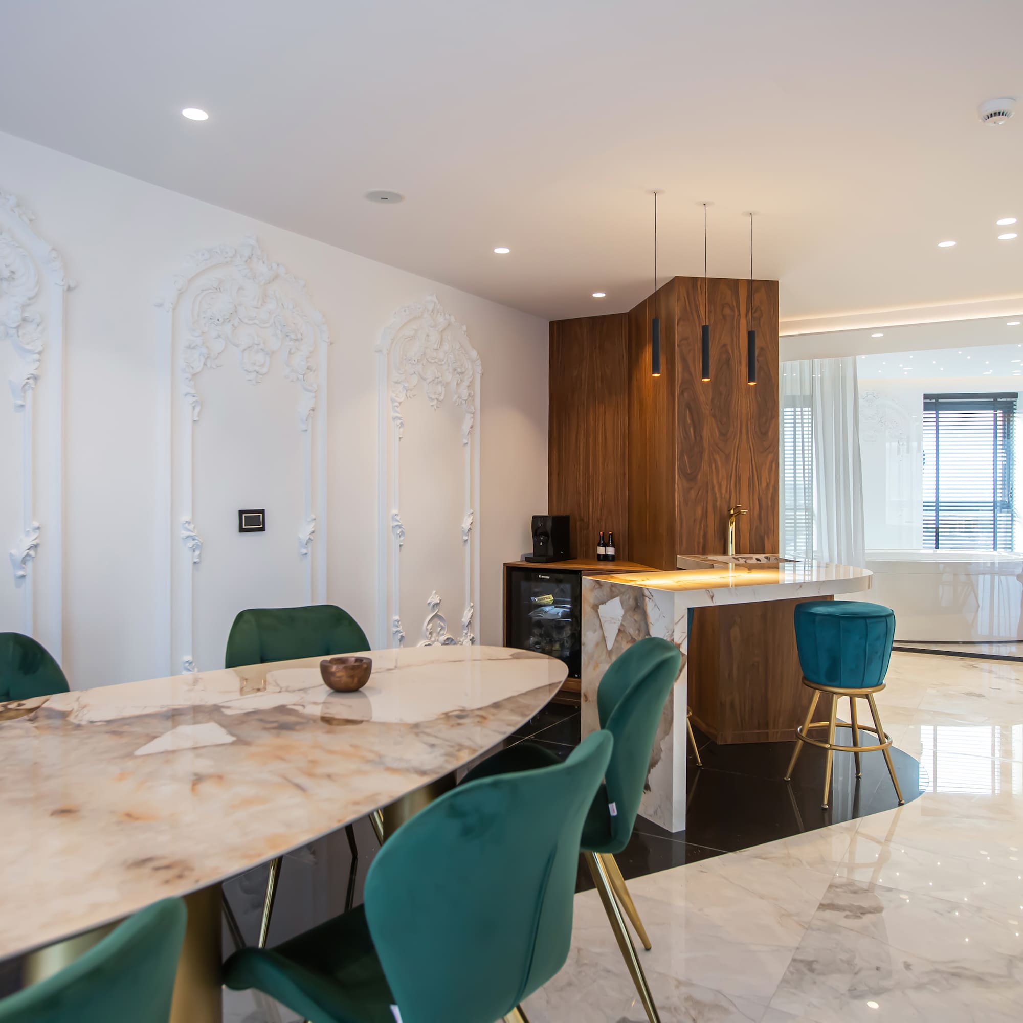 a dining room with a marble table and chairs
