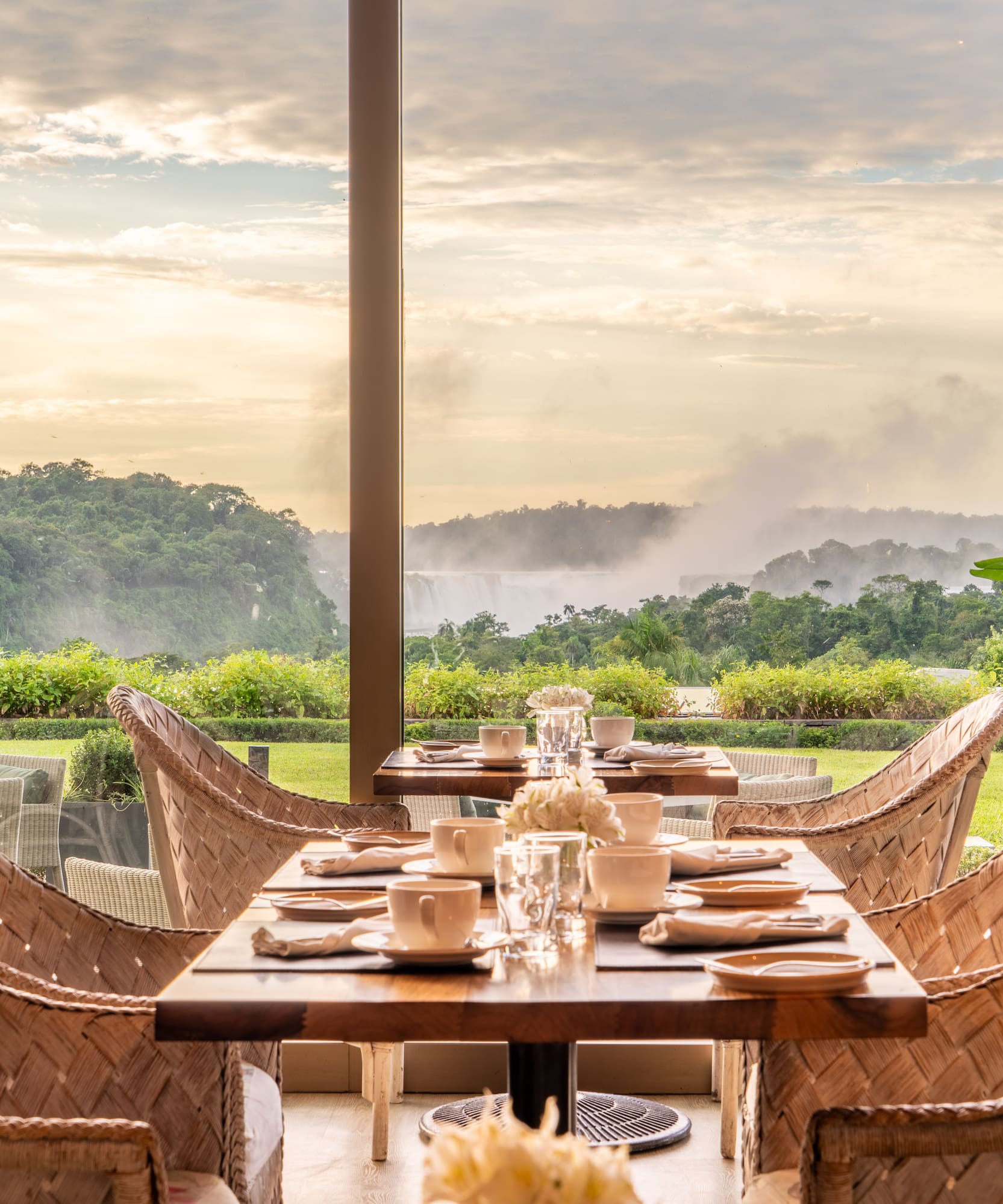 a table with chairs and plates on it