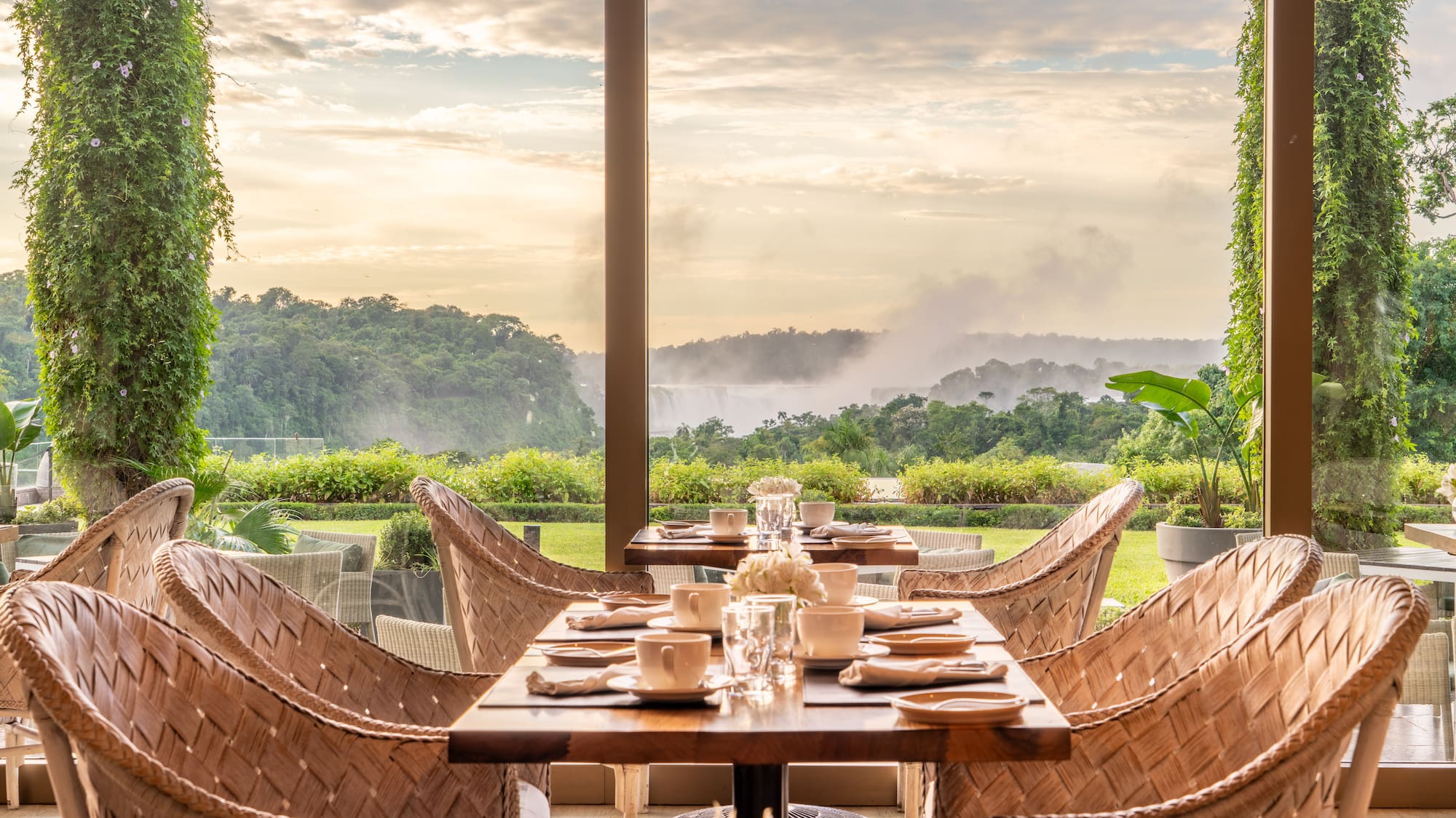 a table with chairs and plates on it