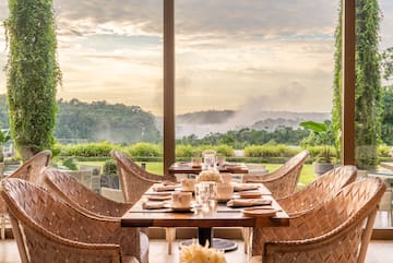 a table with chairs and plates on it