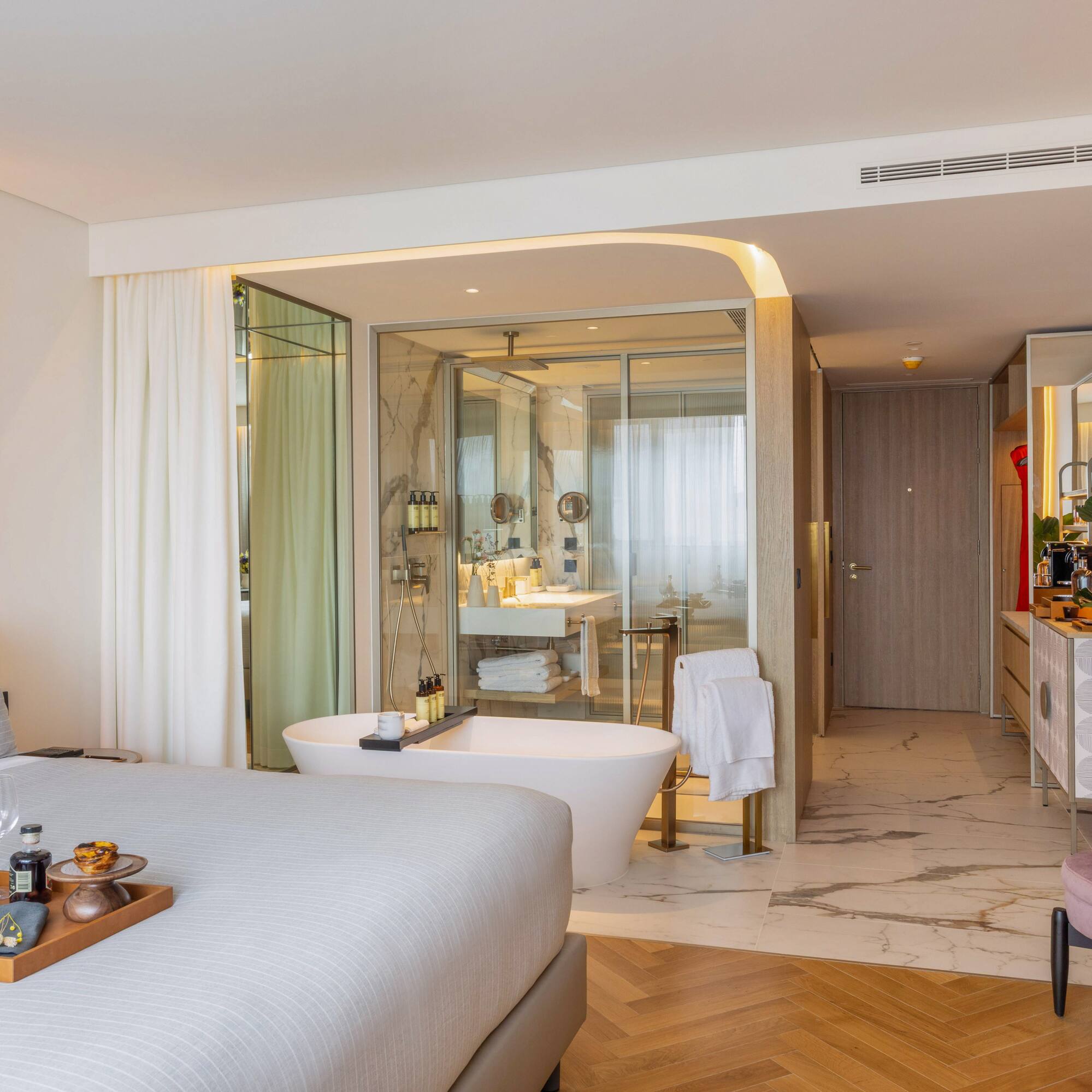 a room with a bed and bathtub