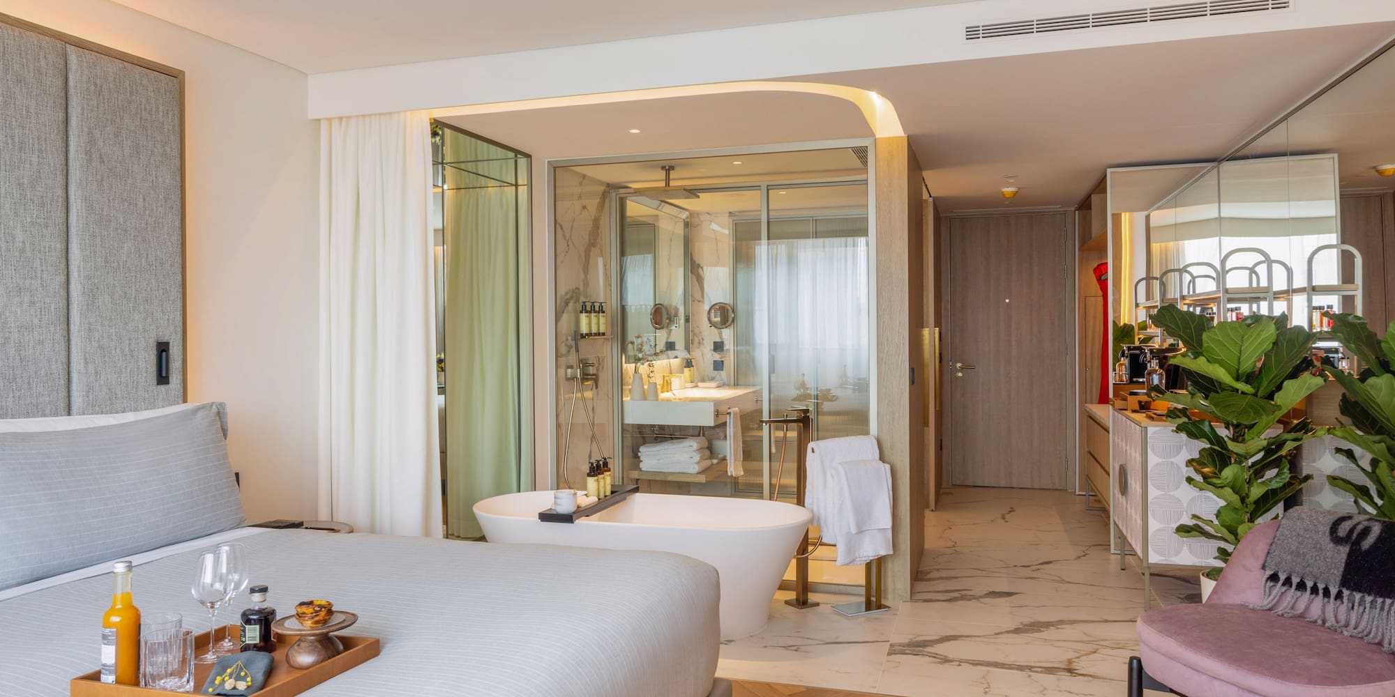 a room with a bed and bathtub