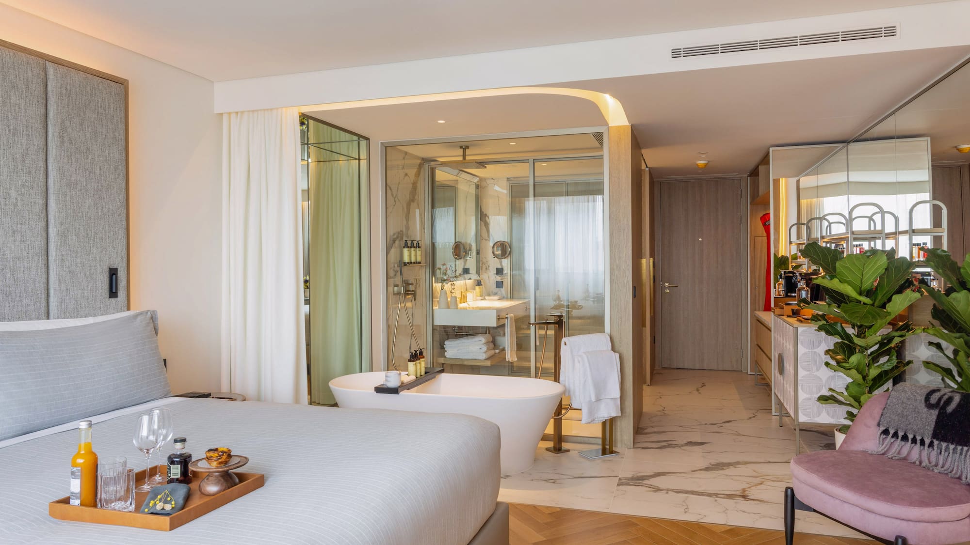 a room with a bed and bathtub