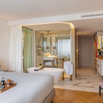 a room with a bed and bathtub