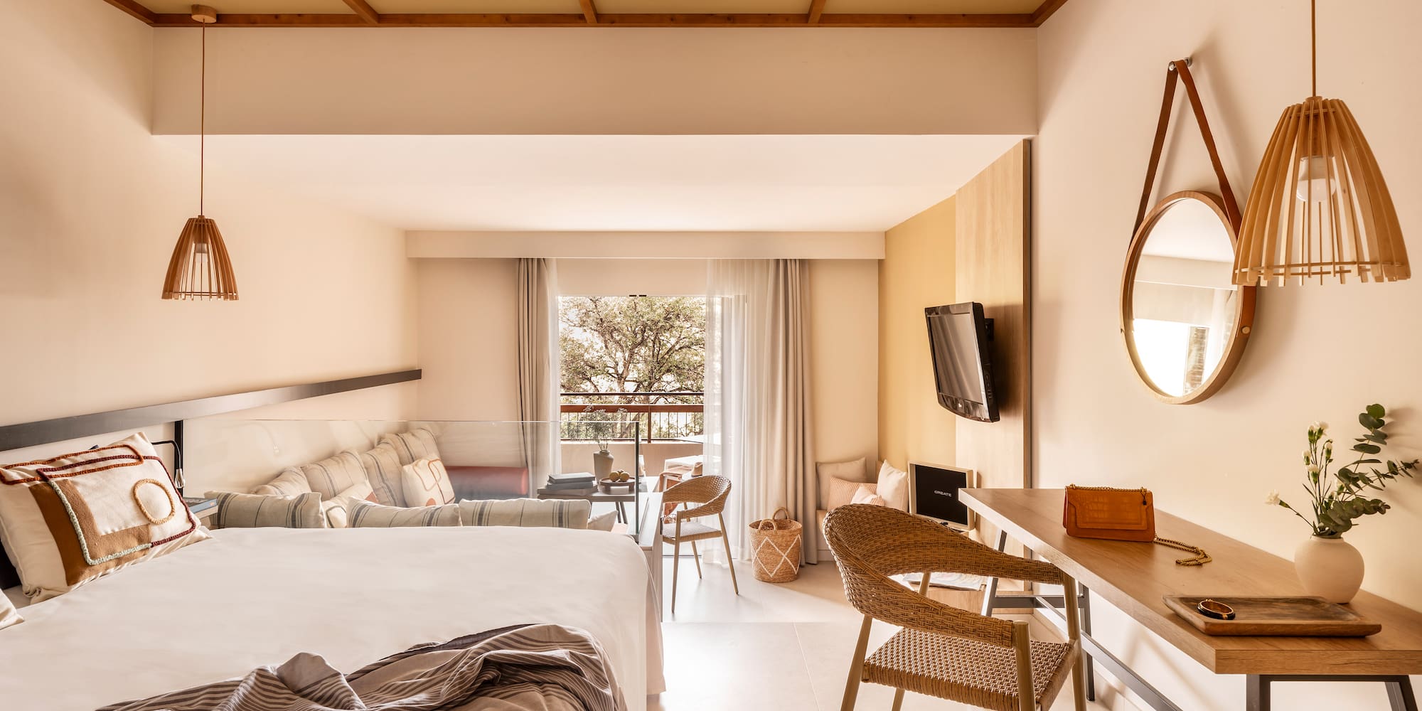 a room with a bed and a television