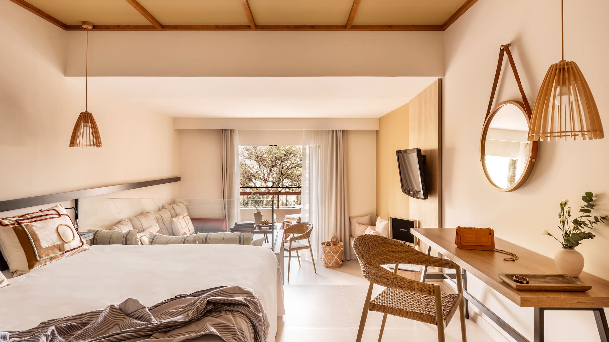 a room with a bed and a television