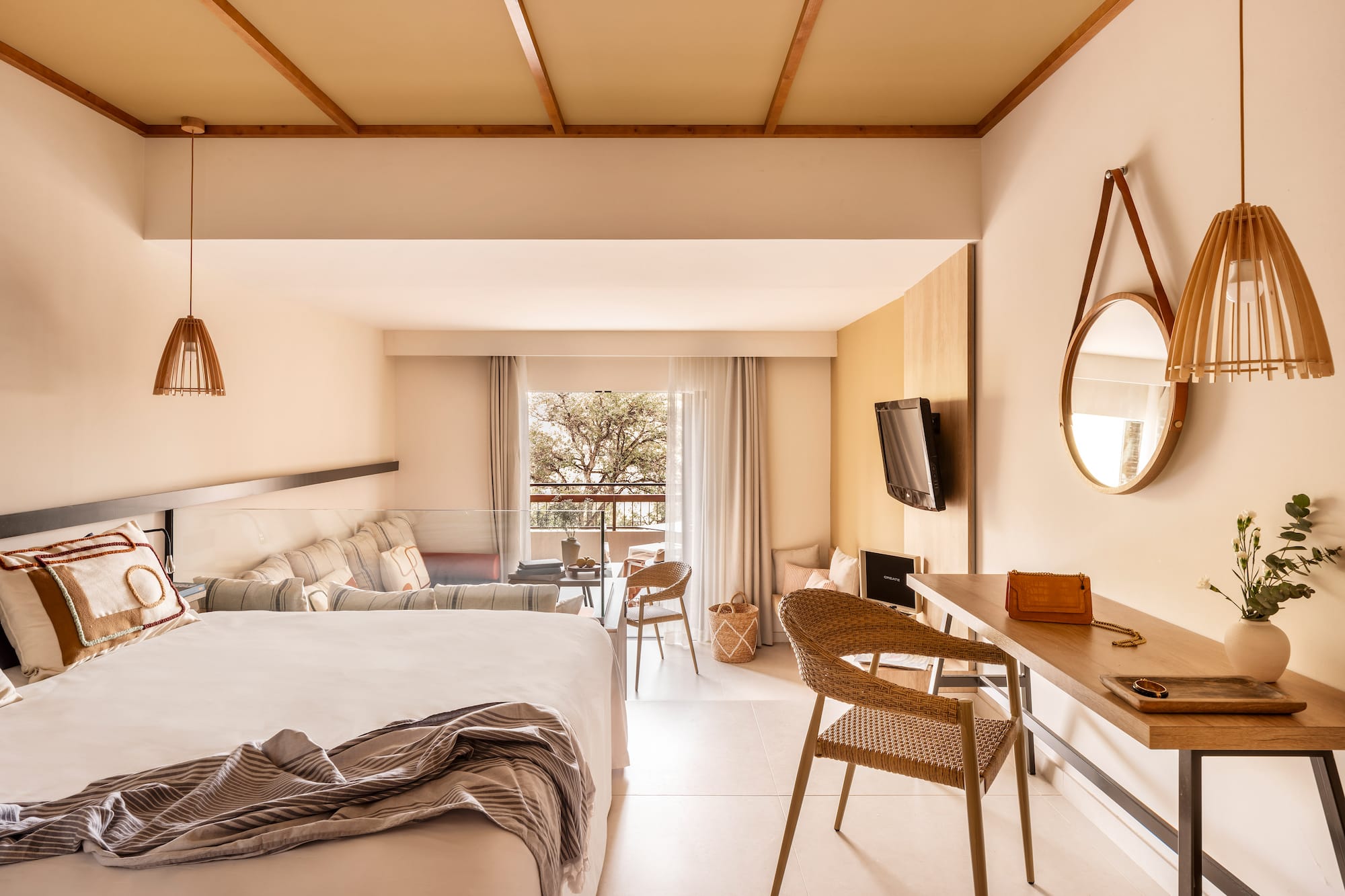 a room with a bed and a television