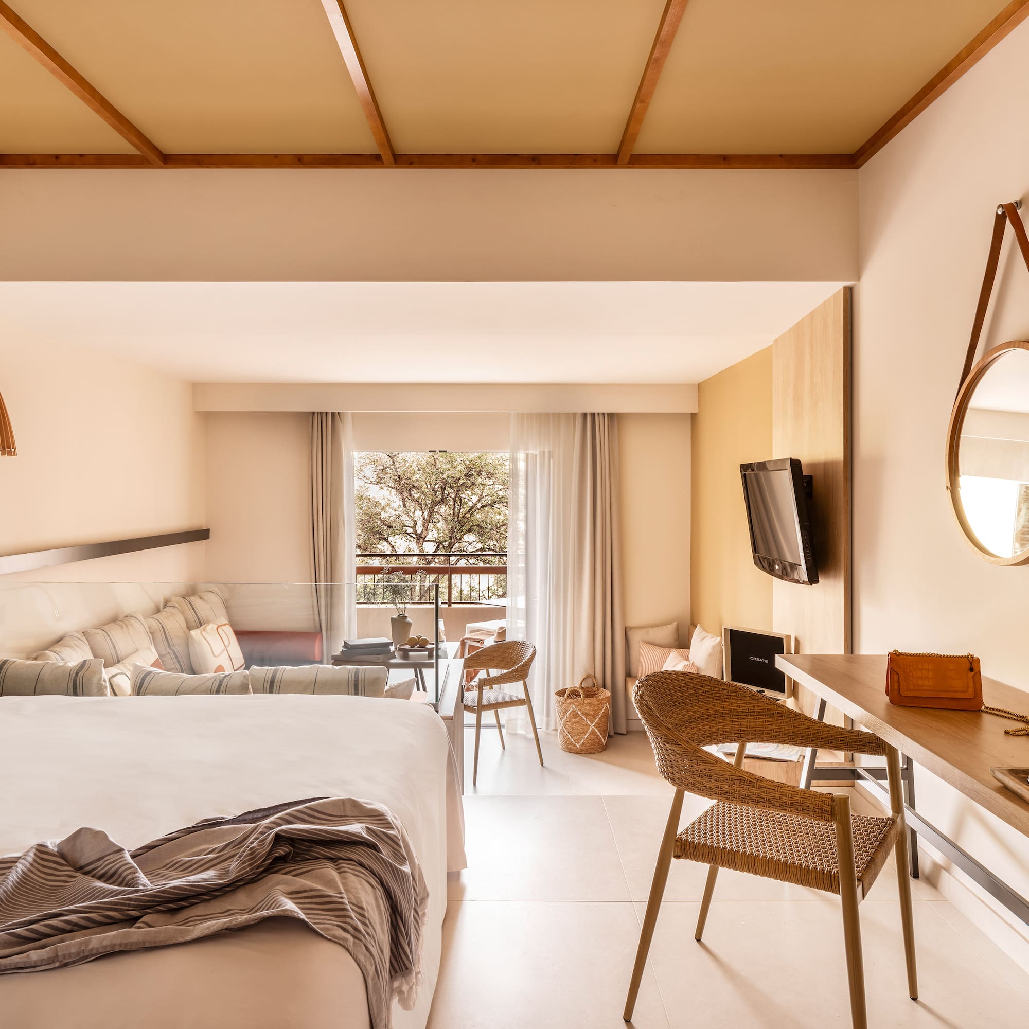 a room with a bed and a television